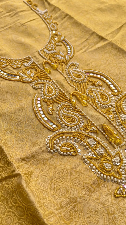 Pakistani Designer Yellow Shade Soft Tissue Suit with Bead & Paisley